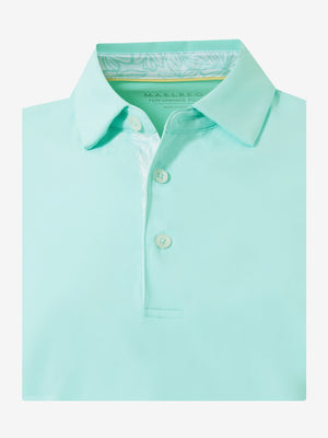 Flat lay of the folded aqua blue everyday classic solid polo, showcasing the neat silhouette and solid color design