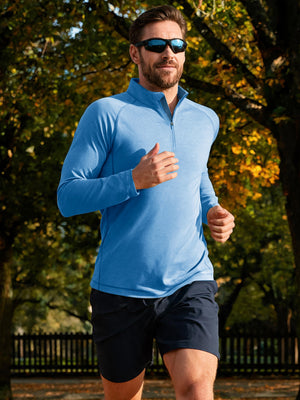 Model outdoor sports activity shooting scene, dry fit athletic 1/4 zip sweatshirt in blue heather