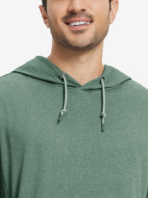 Close-up from nose to chest, showing soft heather texture and collar detail of the dark green melange hoodie.