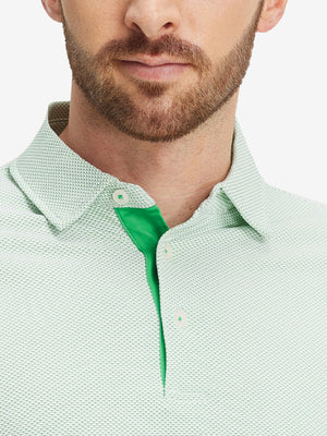 Close-up of a model wearing the emerald feather weight jacquard polo shirts, focusing on the collar and face.