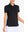 Front view from nose to hem of model wearing BLACK Women's Performance Solid Polo with skirt
