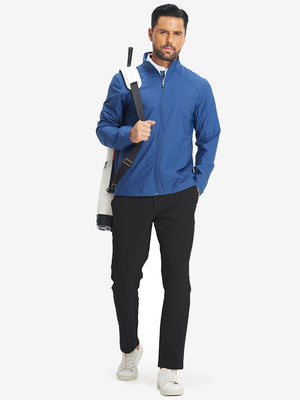 Full-body shot of model with golf bag on back wearing black water-resistant stretch heat-tech winter trousers