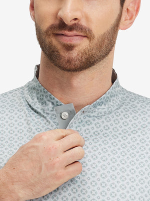 Close-up: nose to chest in gray geometric stretch printed collarless henley golf shirts