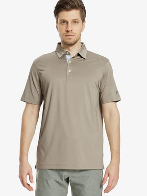 Front half-body view of male model in the Dark Khaki Everyday Classic Solid Polo, standing still