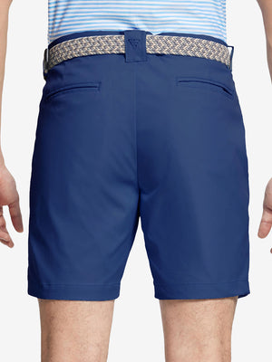 Back waist to knee view of cobalt water resistant golf 7 inch shorts, flexible performance fit.