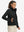 Model wearing women's lightweight fleece-lined puffer jacket, black, front upper-body look.