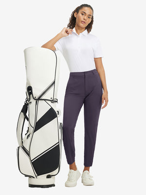 Woman wearing Women's Ultra-stretch Quick Dry Sweatpants with Ankle Zips in dark purple, full body front view