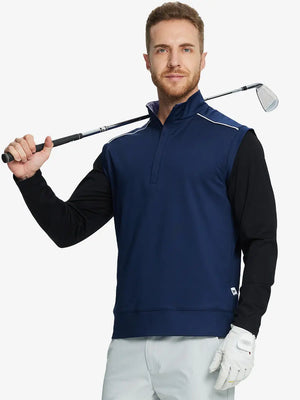 Half-body front view of model holding golf club wearing NAVY Stretch Solid Fleece Quarter-Zip Vest.								
