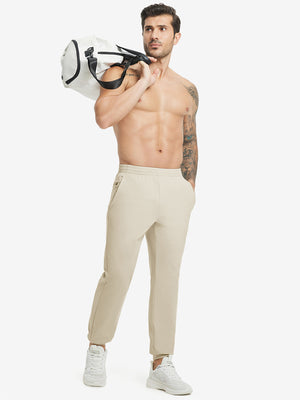 Full body front view of model wearing Water Resistant Comfy Fleece Golf Joggers in light khaki