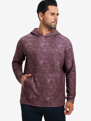 Model in purple red exclusive print kangaroo hoodies with hands in pocket, relaxed front upper view.