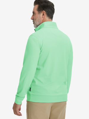 Back upper body view of the light green lightweight golf pullover, model turns head slightly with ease.