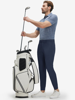 Front full body shot of model wearing navy flat front golf joggers pants with belt loops