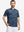 Front half-body of model in dark blue plant stretch printed collarless henley golf shirts