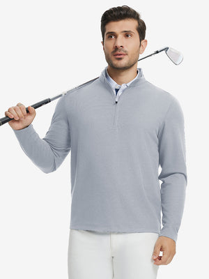 Full body model holding golf club in Premium jacquard quarter zip pullover, light grey style