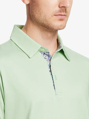 Male model wearing the Canary Green Everyday Classic Solid Polo, front view from nose to chest