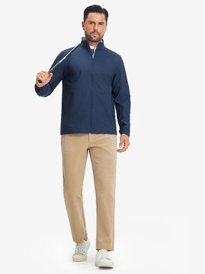 Model holding golf club wearing lightweight water-resistant outerwear jacket, active blue indigo style