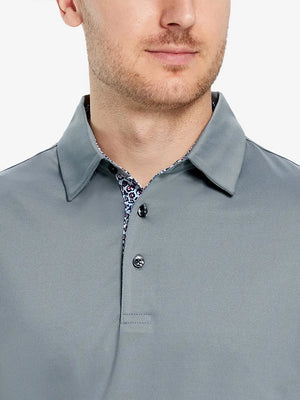 Male model wearing the Light Grey Everyday Classic Solid Polo, front view from nose to chest