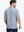 Back half-body view of model in STERLING GREY FLOWER Popular Heather Print Polo