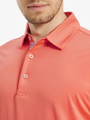Male model wearing the Melon Everyday Classic Solid Polo, front view from nose to chest