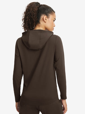 Back upper view of model in women's lightweight hoodies pullover, showing relaxed fit in coffee brown.