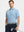 Model holding club in LIGHT BLUE/COBALT STRIPE Polo with sporty confidence