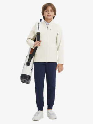 Full-body view of model wearing kids soft lightweight fleece lined jacket in beige, displaying the jacket's fit and design.