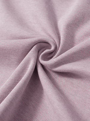 Fabric close-up showing the material of red two tone pique cotton blend q-zip.