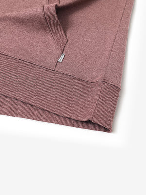 Hem detail of the Pink Heather Athletic Golf Hoodie, highlighting clean stitching and neat design.