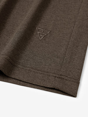 Hem detail of Men’s Long Sleeve Mock Turtleneck Shirt in Brown, showcasing smooth finish.