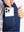 Close-up of boys full-zip fleece-lined puffer vest pocket holding a phone, practical detail in dark blue