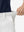 Detail view of elastic waistband on white women's regular fit stretchy golf pants