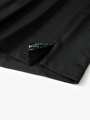 Close-up of side slit detail on the Black Everyday Classic Solid Polo hem