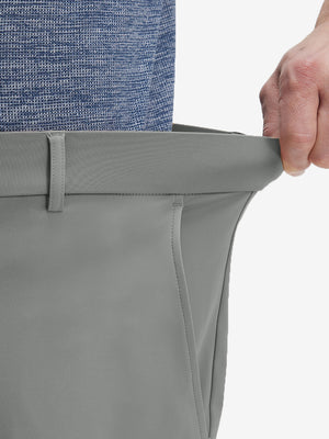 Detail view of elastic waistband on iron grey flat front golf joggers pants with belt loops