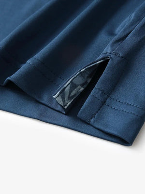 Close-up of side slit detail on the Blue Everyday Classic Solid Polo hem