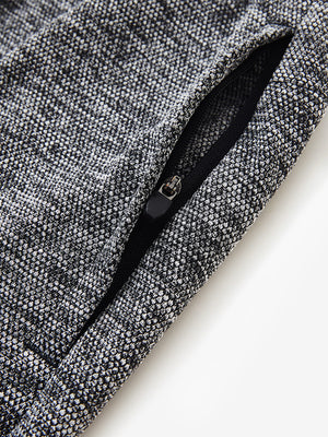 Detail of zipper pocket on soft sweatpants with 4 zipper pockets in black heather