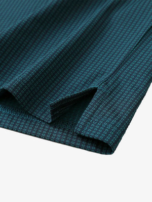 Hem slit detail close-up on TURQUOISE Elegant Performance Jacquard Polo