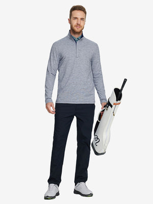 Man wearing Heather Pinstripe Brushed Dry Fit Quarter Zip Pullover in navy, holding golf club on course