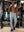 Full-body view of model in gym wearing LIGHT GREY Performance Tapered Sports Joggers