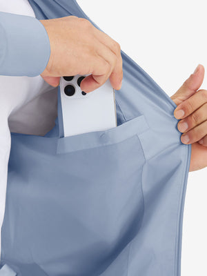 Hand placing iPhone into inner pocket of casual windproof bomber jacket in slate blue