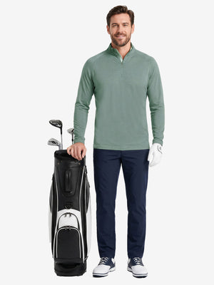 Full body model holding golf equipment for shooting, dry fit athletic 1/4 zip sweatshirt in celadon green heather