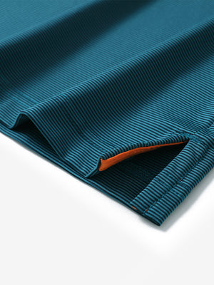 Hem detail of Long sleeve pinstripe jersey polo with neat finish in turquoise stripe