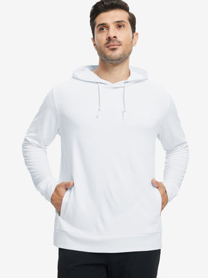 Model with one hand in pocket, wearing classic heather pullover hoodie in white, relaxed look.
