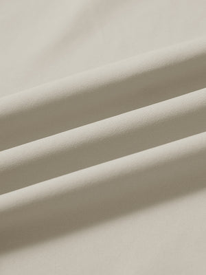 Fabric close-up of print collar quarter zip golf vest, smooth material with subtle texture in khaki light