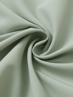 Fabric detail of Windproof golf vests with zip pockets showing smooth texture in light green