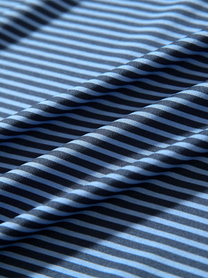 Fabric detail of Classic stripe polo shirts with crisp lines and smooth blue denim stripe finish