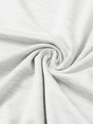 Close-up of fabric on men's long sleeve mock turtleneck shirt, soft knit texture with subtle stretch in white