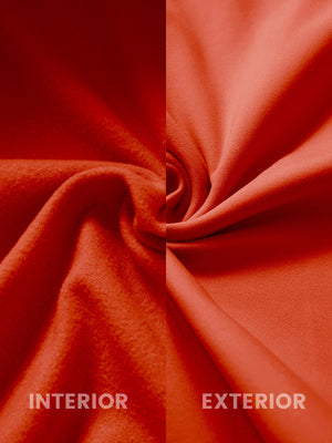 Inside and outer fabric close-up of orange youth winter micro-fleece quarter zip pullover, soft fleece.