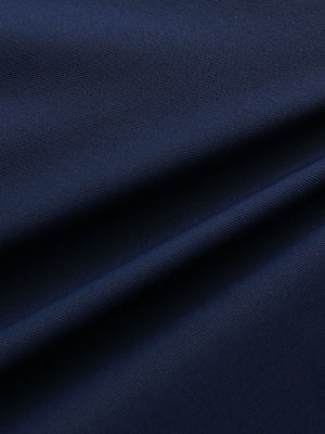 Close-up of navy water resistant golf shorts fabric showing durable weave and protective coating.