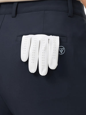 Detail view of back pocket on navy women's regular fit stretchy golf pants