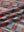 Full print lightweight quarter zip pullover, close-up of smooth fabric with detailed print in red/black/white plaid